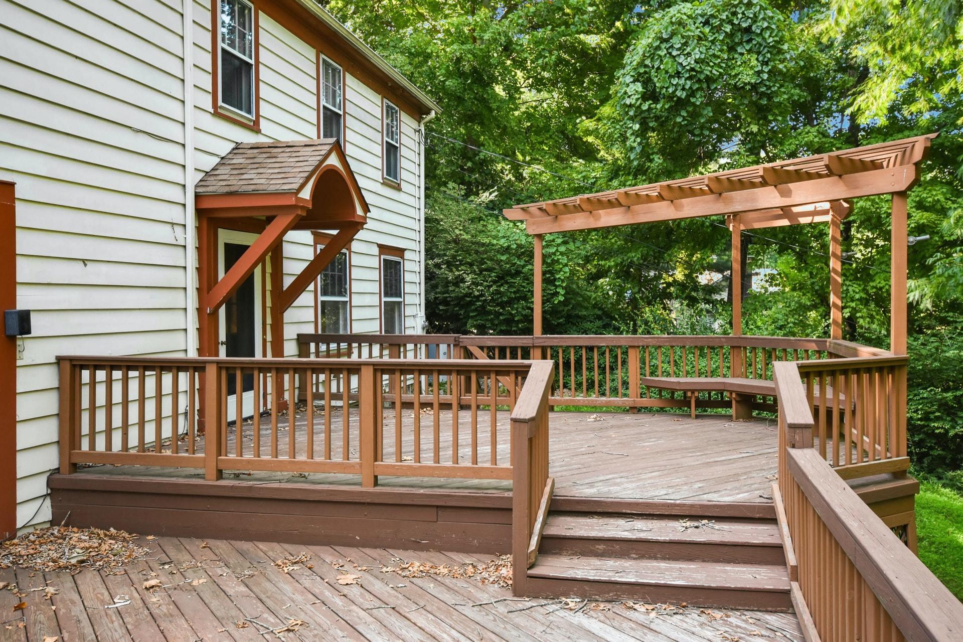 221 Mill Road New Canaan, CT 06840 - Photo 3 of 32 a view of a roof deck with wooden floor and fence