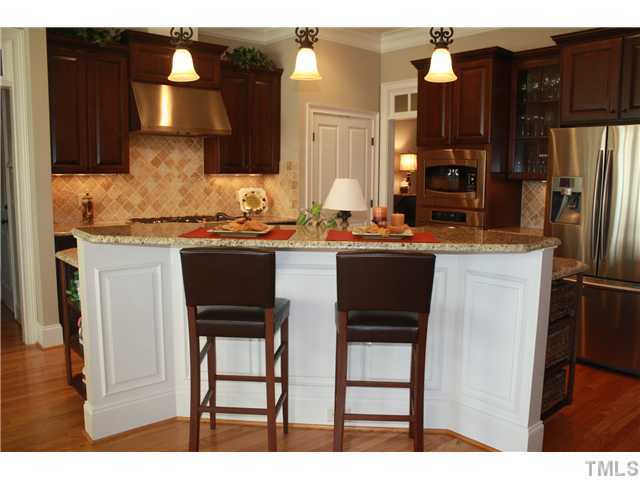 2812 Winter Song Road Raleigh, NC 27614 - Photo 11 of 24 You will enjoy your morning cereal and coffee at this lovely raised breakfast bar, which is graced by wainscoting, granite counter-tops, and lovely pendant lighting.
