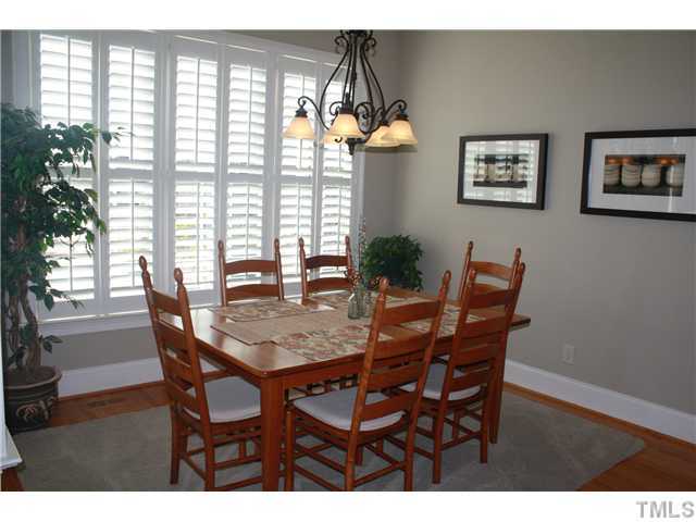 2812 Winter Song Road Raleigh, NC 27614 - Photo 12 of 24 You will enjoy your mornings in this bright & cheerful breakfast room. This lovely room features lots of windows to let in plenty of light, plantation shutters, an elegant chandelier & hardwood floors. A French door leads to the grand screened-in porch.