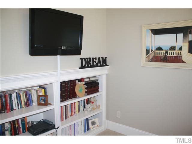 2812 Winter Song Road Raleigh, NC 27614 - Photo 17 of 24 The spacious sitting room in this master suite is perfect for watching a late night movie. Built-in shelving provides storage for all your favorite media collections and equipment.