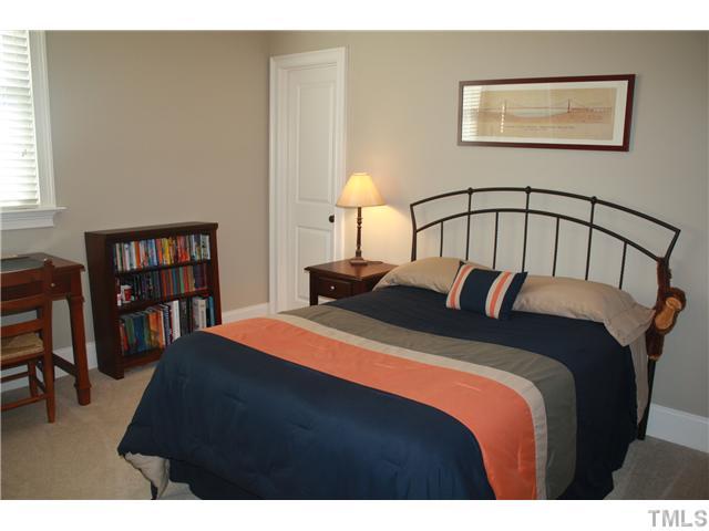 2812 Winter Song Road Raleigh, NC 27614 - Photo 21 of 24 This lovely bedroom is tastefully decorated and features a walk-in closet with additional alcove storage. Room has direct access to the buddy bath with a separate vanity room.