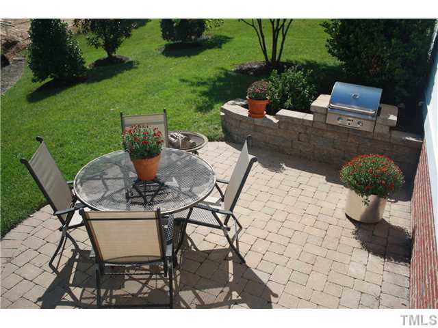 2812 Winter Song Road Raleigh, NC 27614 - Photo 23 of 24 For your continued outdoor enjoyment, this paver patio provides the perfect place to entertain guests while grilling out on this built-in gas grill.