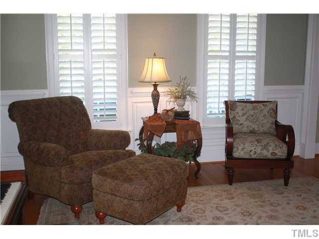 2812 Winter Song Road Raleigh, NC 27614 - Photo 4 of 24 This lovely dining room is currently being used as a sitting room. This beautiful room boasts plantation shutters, crown molding, chair railing, wainscoting & a trey ceiling with fan for comfort. Hardwood flooring completes the look of this elegant room.