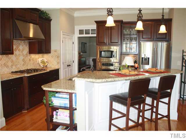 2812 Winter Song Road Raleigh, NC 27614 - Photo 8 of 24 This gourmet kitchen is perfect for the culinary chef in your home! The stainless steel appliance package includes a 5-burner gas cook-top with a stainless steel range hood, wall oven & built-in microwave, dishwasher and stainless steel under mount sink.
