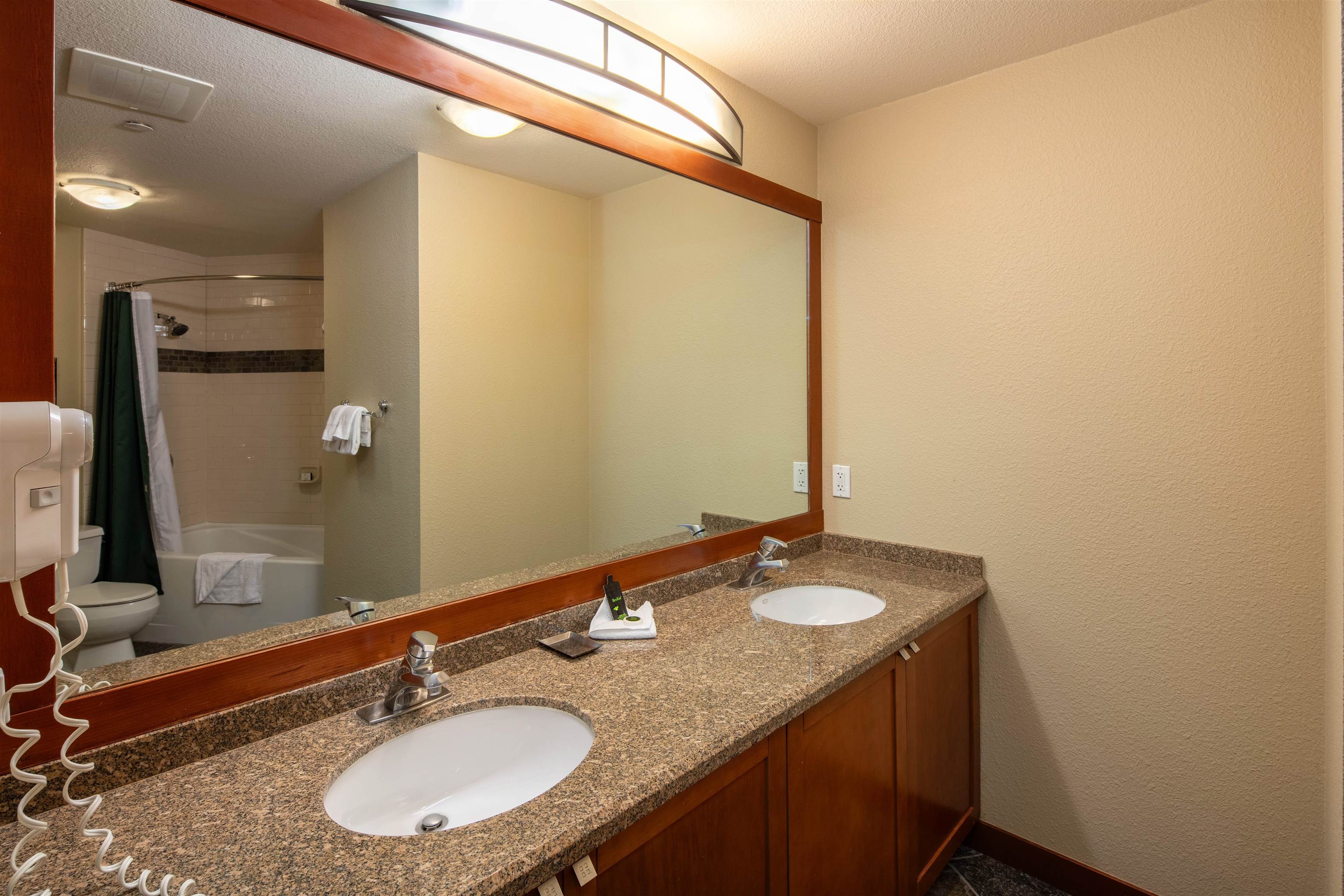 1985 Olympic Vly Road, Unit 2424 Olympic Valley, CA 96146 - Photo 11 of 21 a bathroom with a granite countertop sink and a mirror