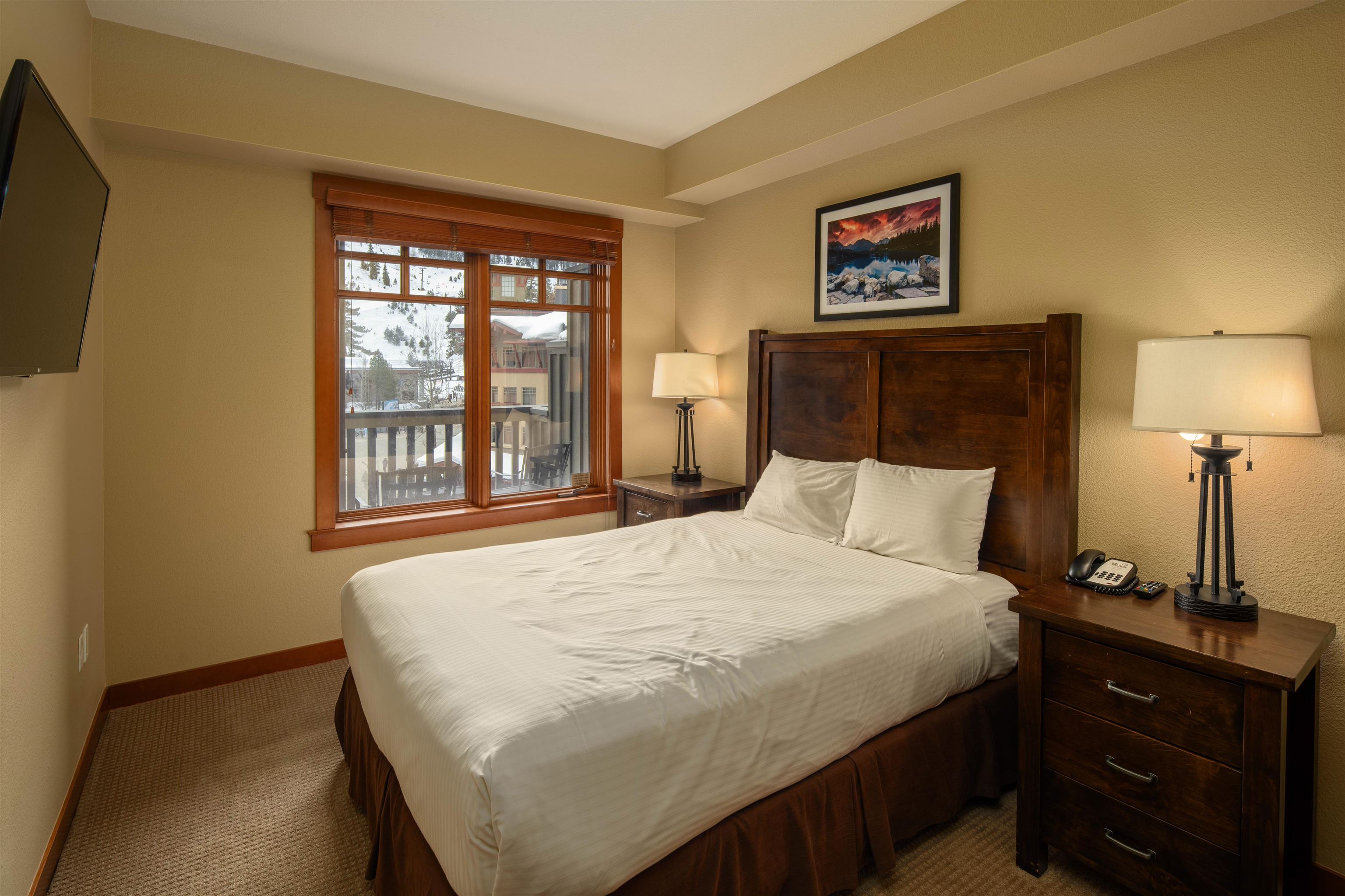 1985 Olympic Vly Road, Unit 2424 Olympic Valley, CA 96146 - Photo 13 of 21 a bedroom with a bed and a window