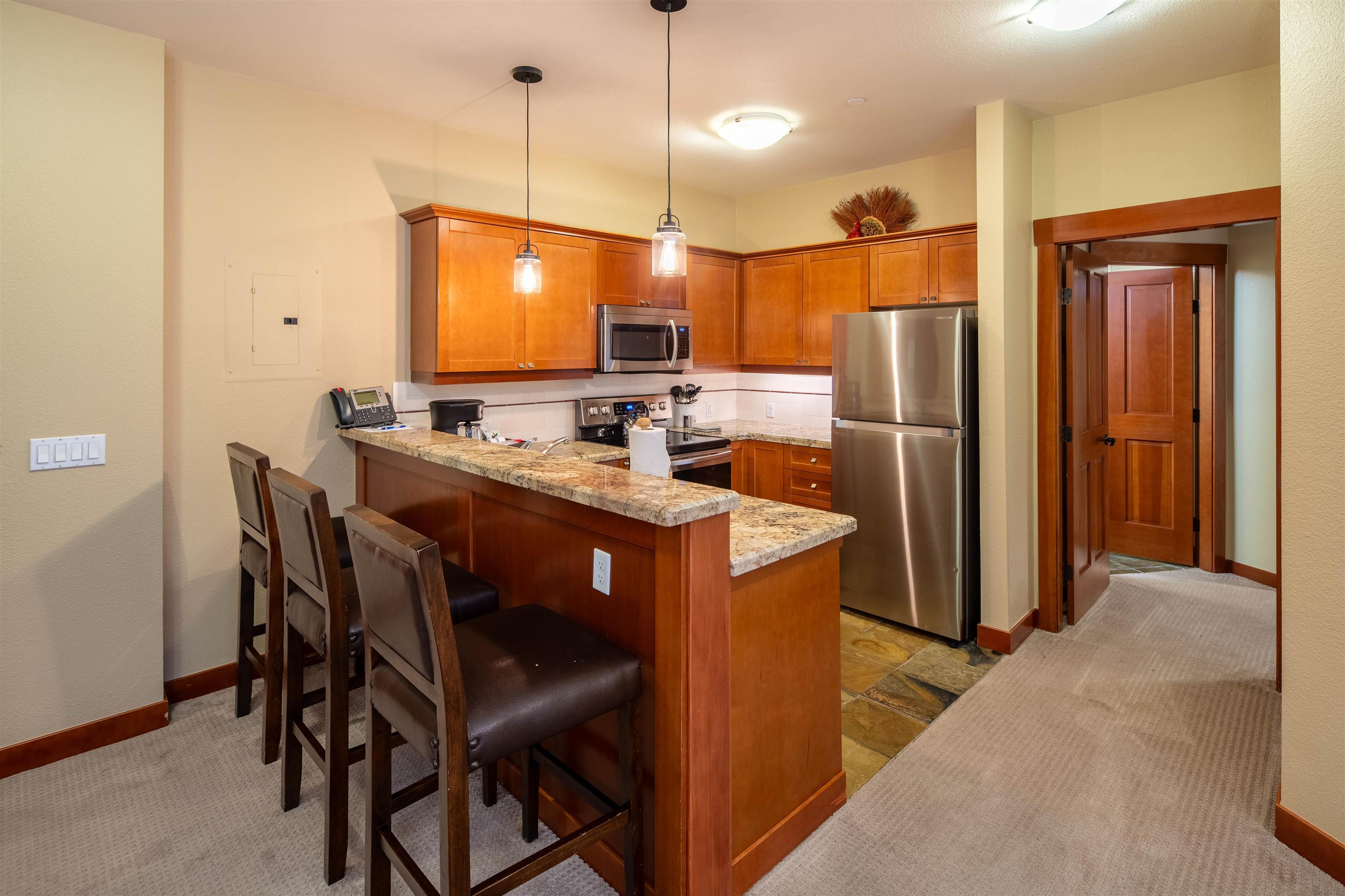 1985 Olympic Vly Road, Unit 2424 Olympic Valley, CA 96146 - Photo 6 of 21 a kitchen with a refrigerator a sink and dishwasher