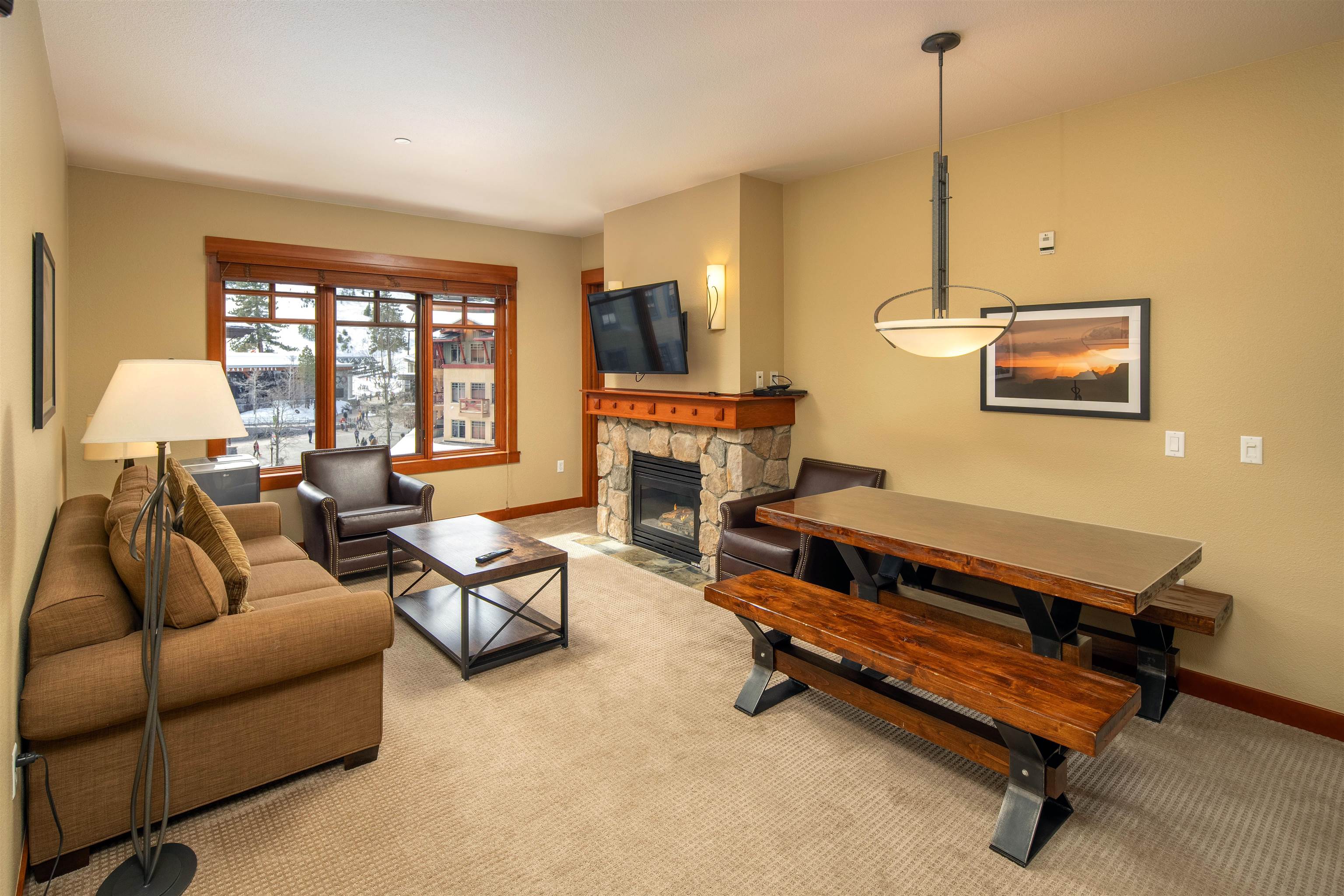 1985 Olympic Vly Road, Unit 2424 Olympic Valley, CA 96146 - Photo 8 of 21 a living room with furniture a window and a chandelier