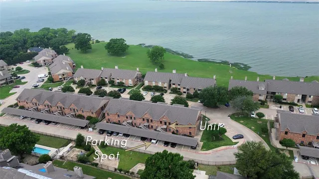 an aerial view of a house with garden space and street view