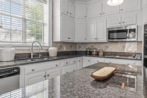 a view of a kitchen from the living room