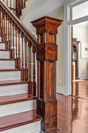 a bathroom with a granite countertop sink a mirror and a shower