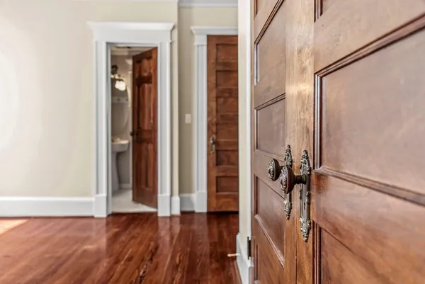 a bathroom with a double vanity sink toilet and shower