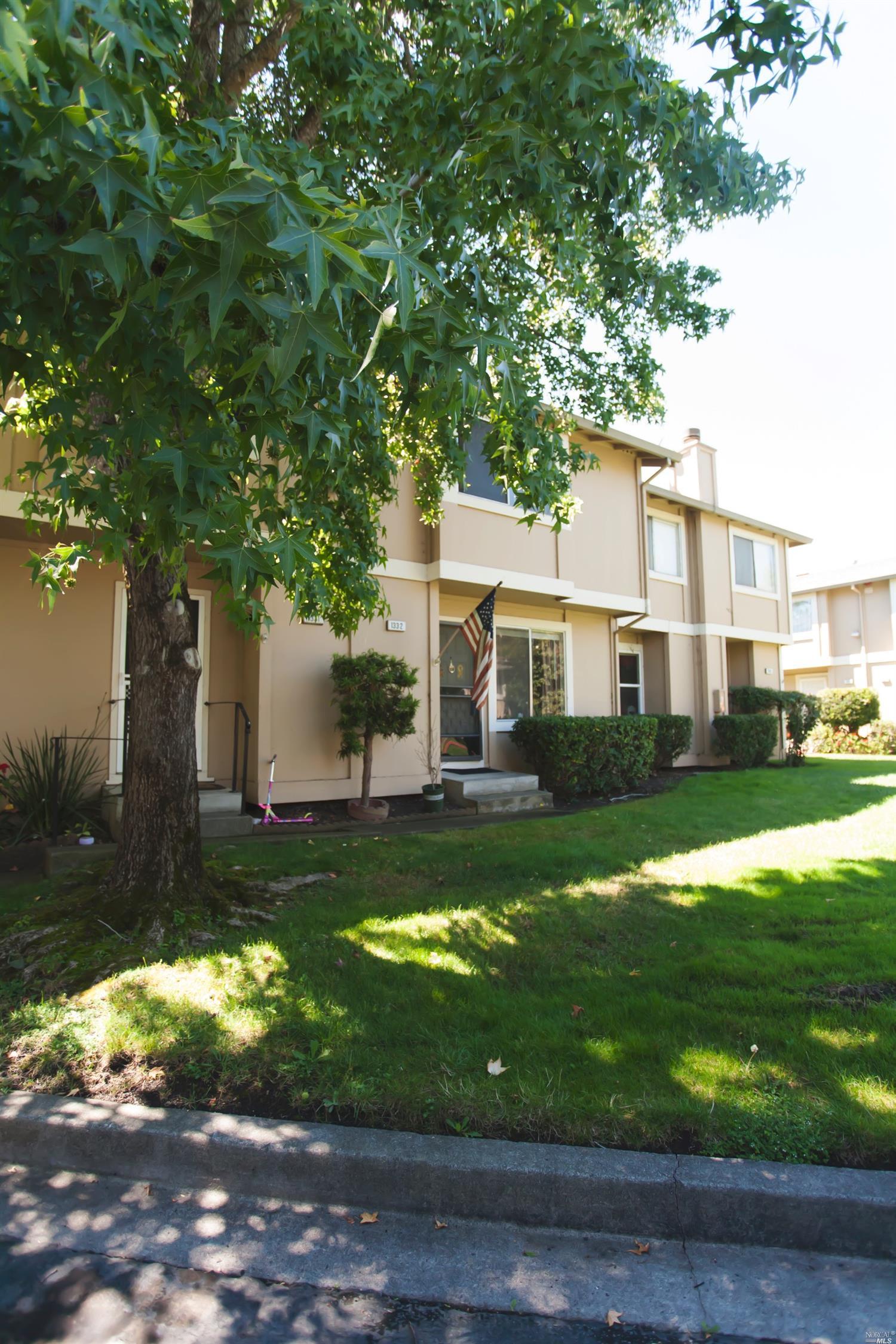 1332 Gold Way Rohnert Park, CA 94928 - Photo 1 of 1 a view of a white house next to a yard with big trees