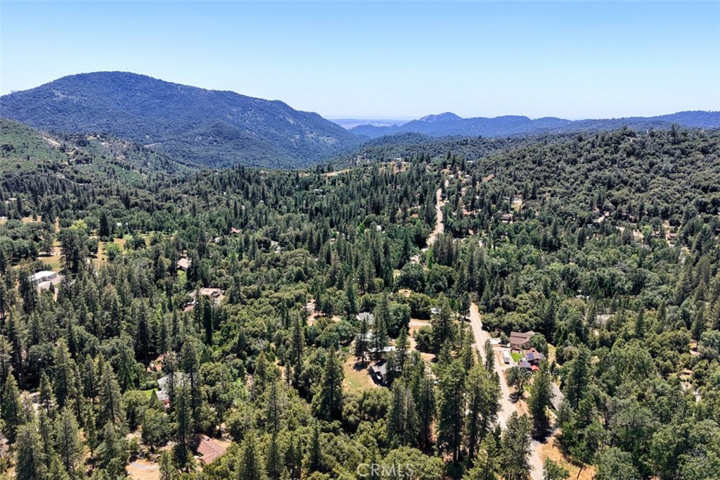 2397 Parmabelle Road Mariposa, CA 95338 - Photo 29 of 34 a view of a houses with a lush green hillside