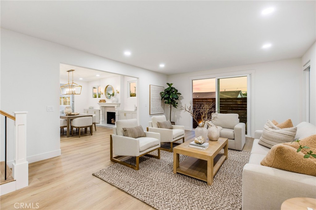 245 Surf Place Seal Beach, CA 90740 - Photo 15 of 65 a living room with furniture and a table