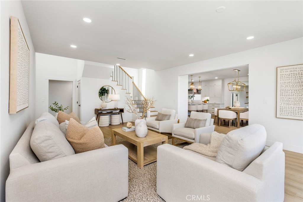 245 Surf Place Seal Beach, CA 90740 - Photo 18 of 65 a living room with furniture and a large window