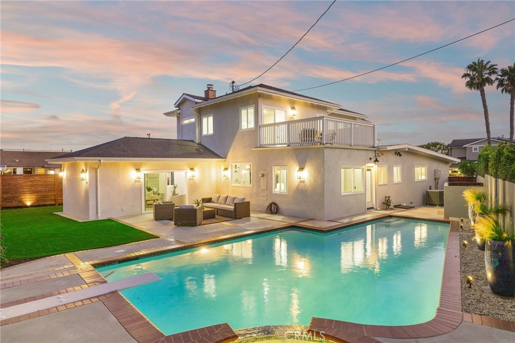 245 Surf Place Seal Beach, CA 90740 - Photo 2 of 65 a view of a house with swimming pool