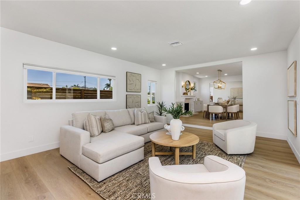 245 Surf Place Seal Beach, CA 90740 - Photo 31 of 65 a living room with furniture and wooden floor
