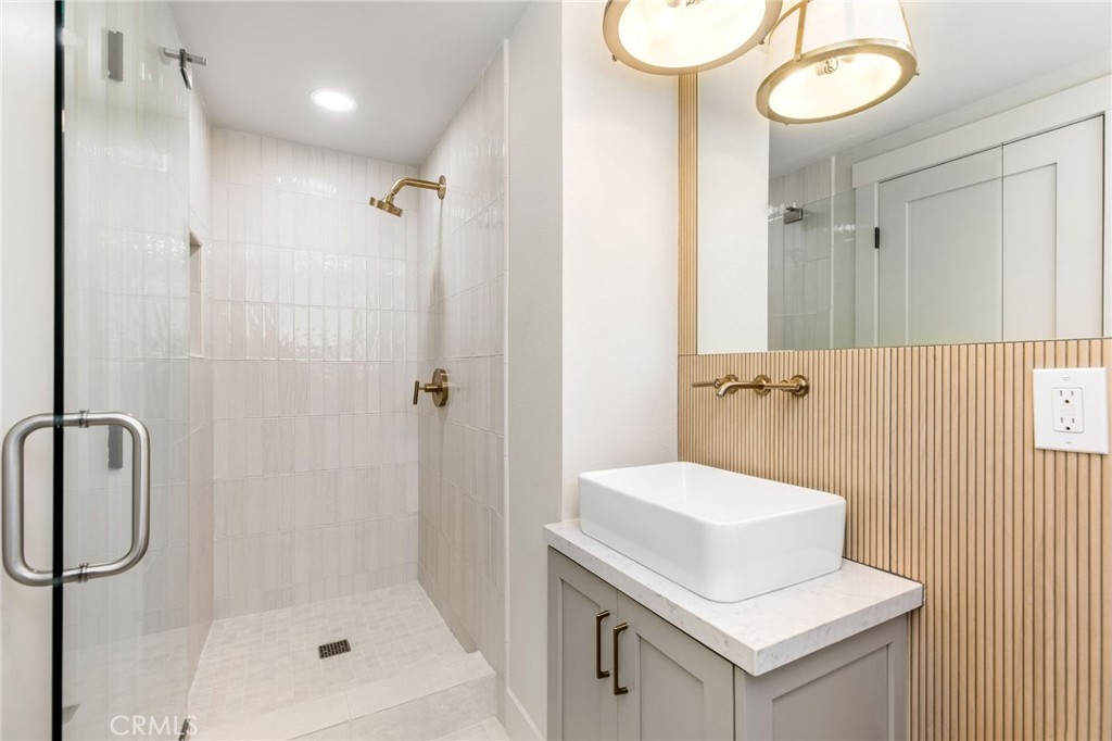 245 Surf Place Seal Beach, CA 90740 - Photo 35 of 65 a bathroom with a sink a toilet and shower