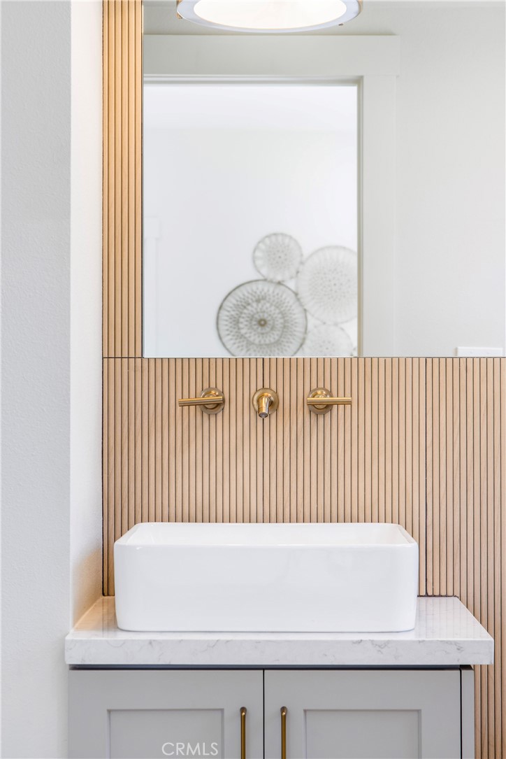 245 Surf Place Seal Beach, CA 90740 - Photo 36 of 65 a bathroom with a bathtub and a window