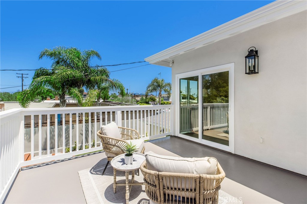 245 Surf Place Seal Beach, CA 90740 - Photo 47 of 65 a view of a chair in wooden deck