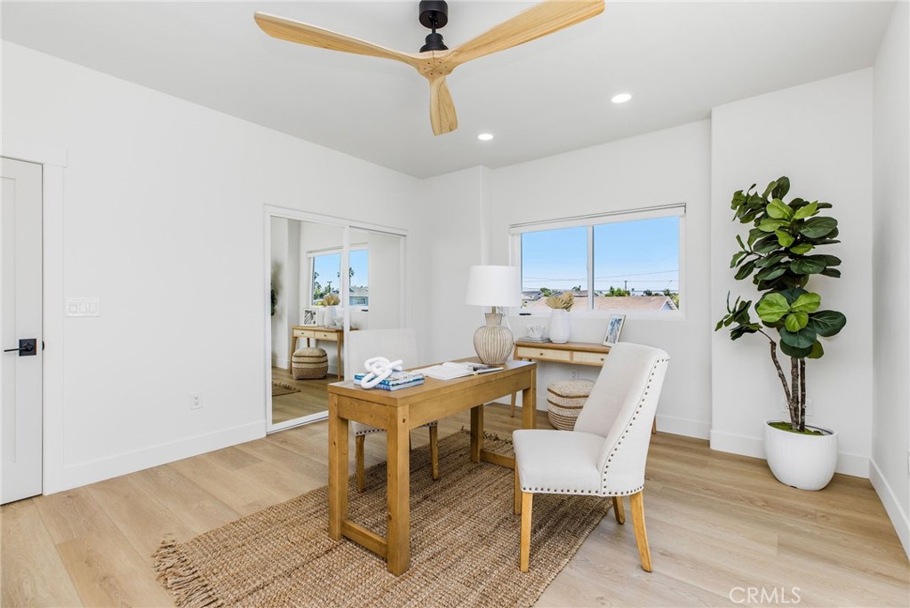 245 Surf Place Seal Beach, CA 90740 - Photo 54 of 65 a view of a dining room with furniture