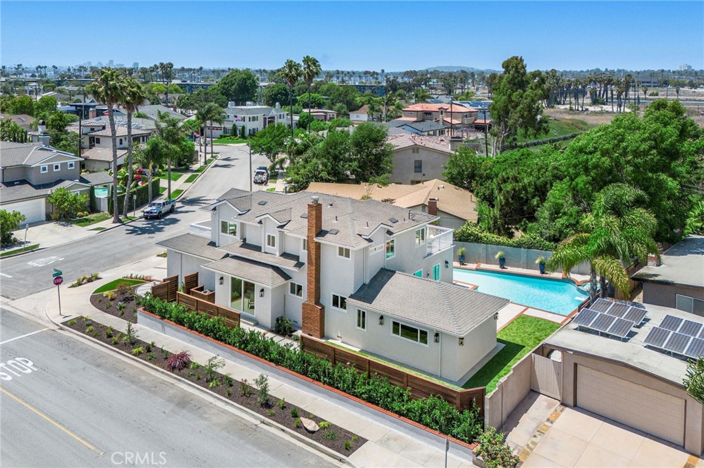 245 Surf Place Seal Beach, CA 90740 - Photo 60 of 65 an aerial view of a house with a garden and trees