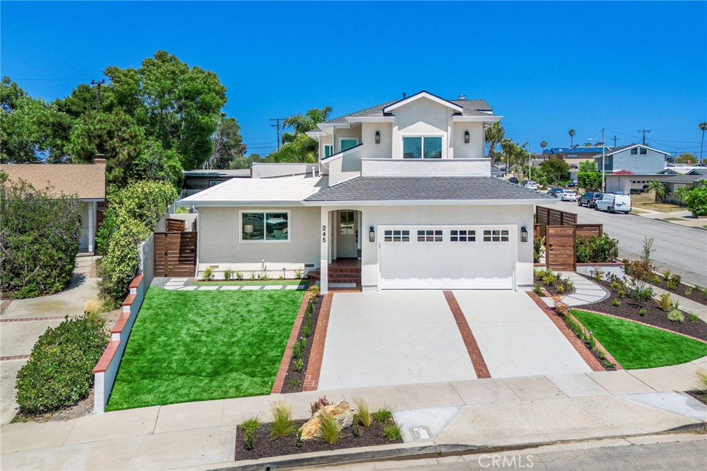 245 Surf Place Seal Beach, CA 90740 - Photo 7 of 65 front view of a house with a yard