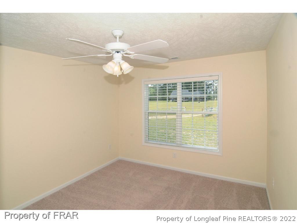 2886 Wade-Stedman Road Stedman, NC 28391 - Photo 13 of 26 a view of an empty room with a window