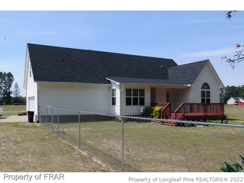 2886 Wade-Stedman Road Stedman, NC 28391 - Photo 21 of 26 a view of an house with backyard space and porch