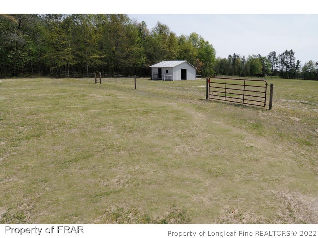 2886 Wade-Stedman Road Stedman, NC 28391 - Photo 22 of 26 a view of a terrace with a yard