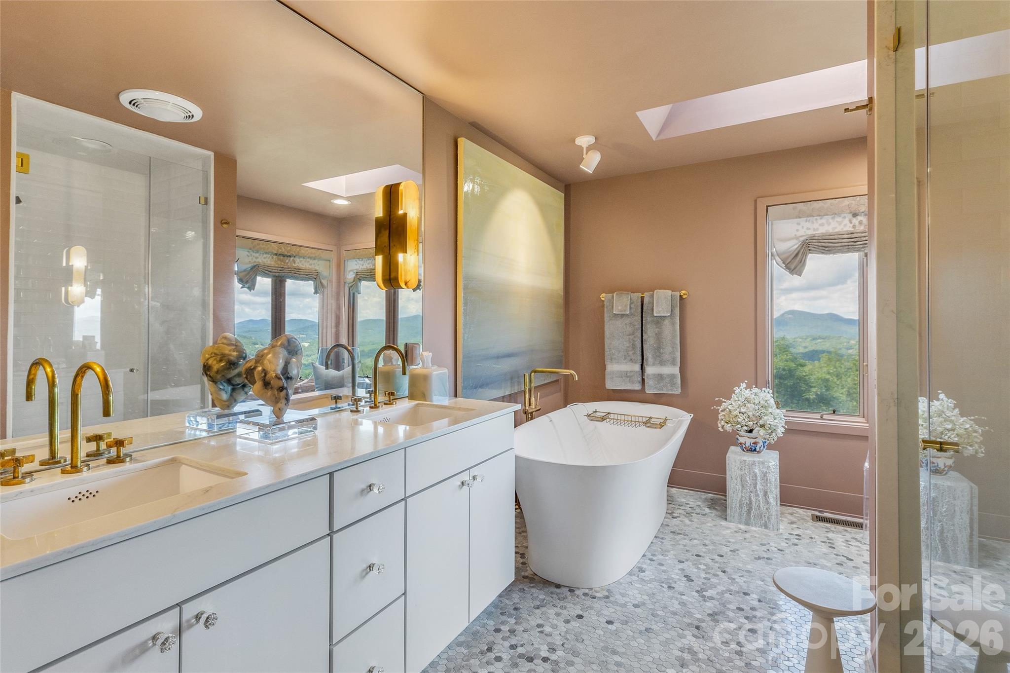 2618 Big Sheepcliff Road Cashiers, NC 28717 - Photo 17 of 35 a large bathroom with a double vanity sink a mirror and a bathtub