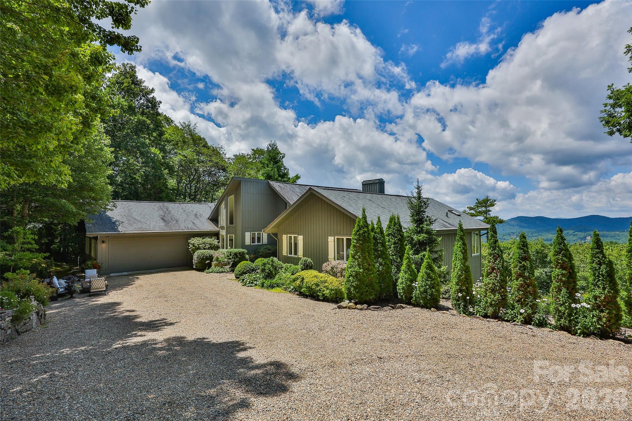 2618 Big Sheepcliff Road Cashiers, NC 28717 - Photo 2 of 35 a view of a house with a yard and plants