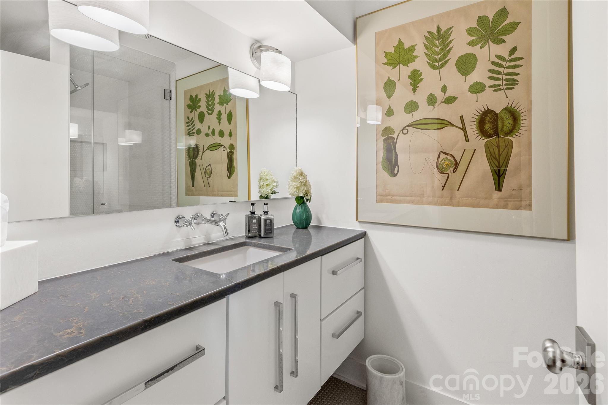 2618 Big Sheepcliff Road Cashiers, NC 28717 - Photo 24 of 35 a bathroom with a granite countertop sink and a mirror