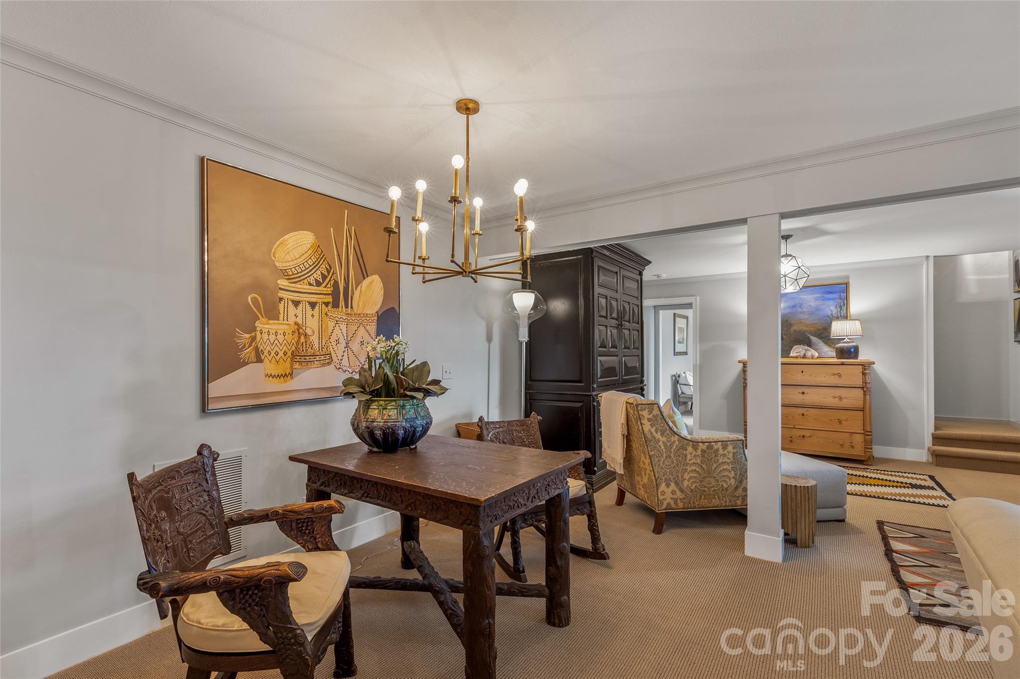 2618 Big Sheepcliff Road Cashiers, NC 28717 - Photo 25 of 35 a view of a dining room with furniture and chandelier