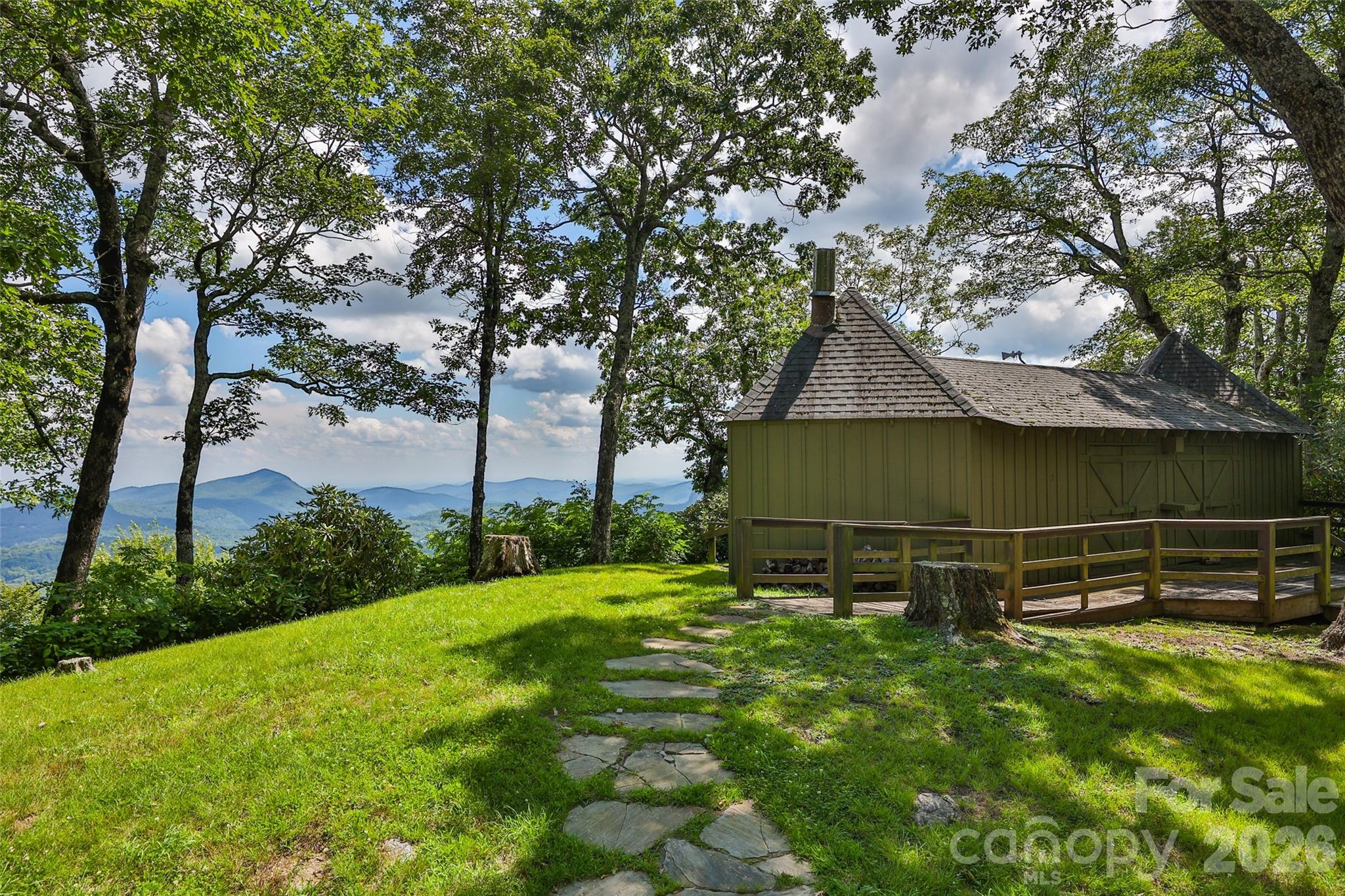 2618 Big Sheepcliff Road Cashiers, NC 28717 - Photo 35 of 35 a backyard of a house with lots of green space