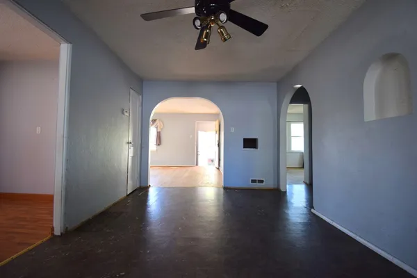 a view of a room with wooden floor closet and windows