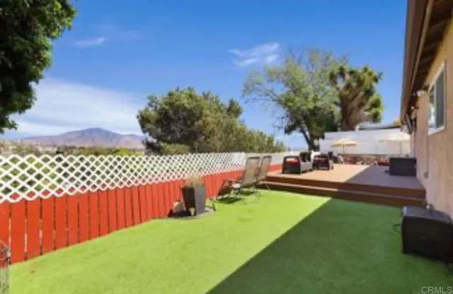 a view of a backyard with a garden