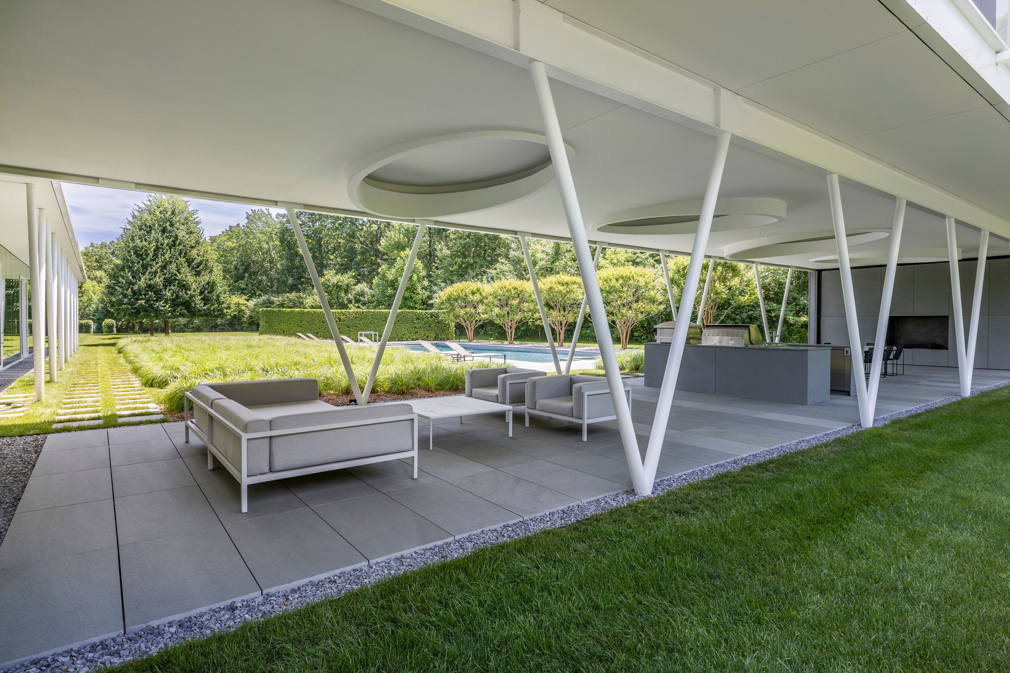 13 Terrys Trail East Hampton, NY 11937 - Photo 14 of 51 a view of a chair and table in the garden