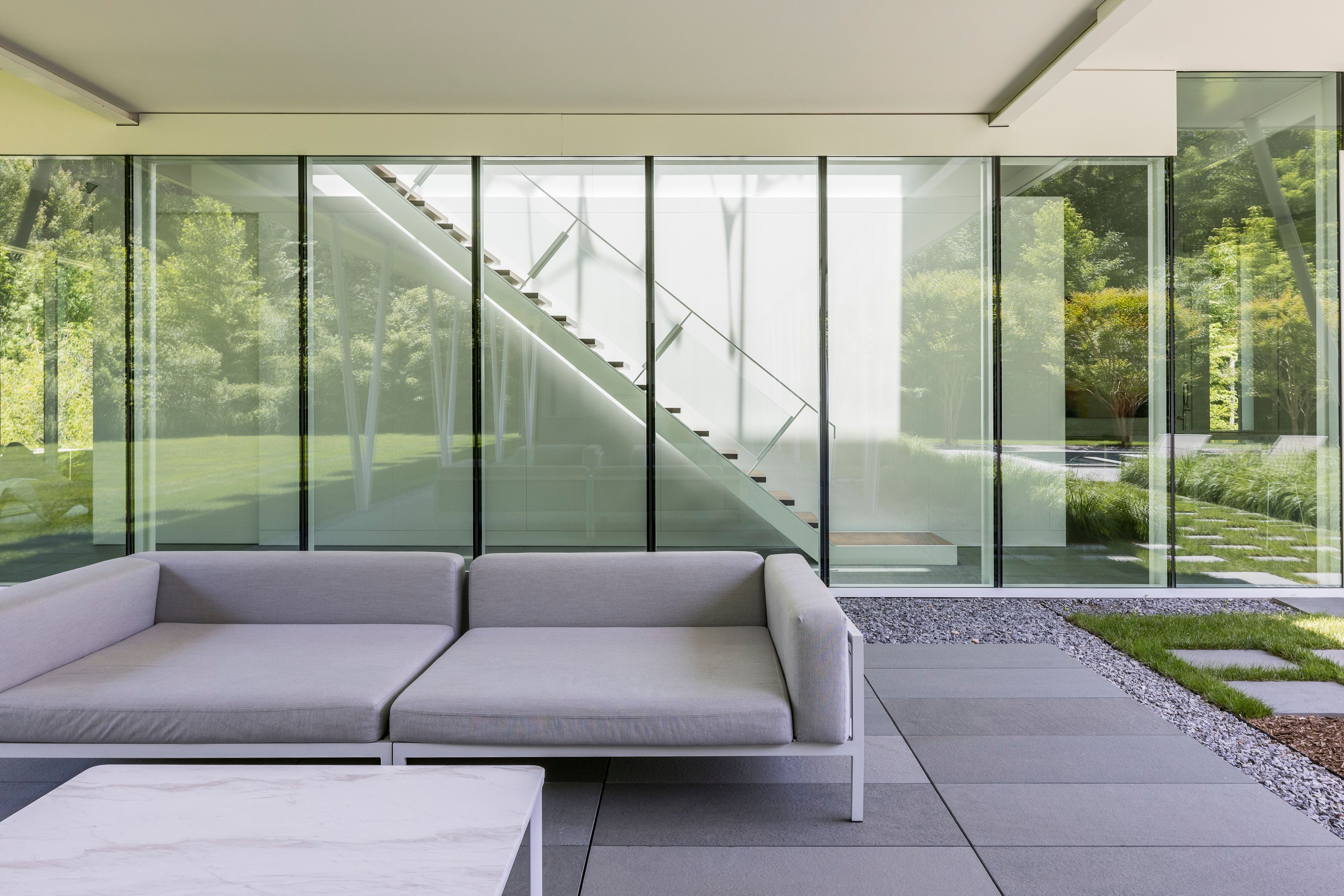 13 Terrys Trail East Hampton, NY 11937 - Photo 15 of 51 a living room with a couch and a large window
