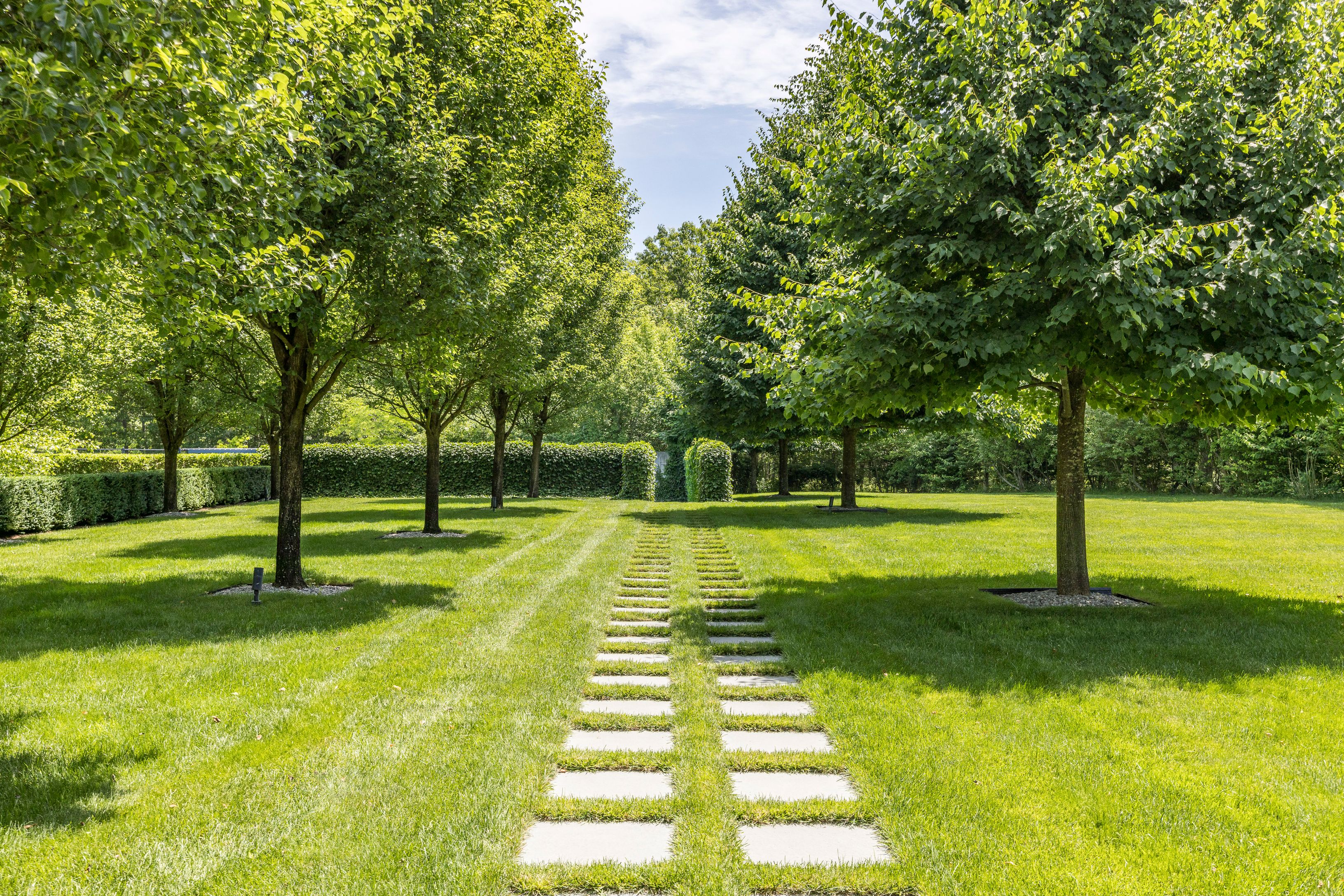 13 Terrys Trail East Hampton, NY 11937 - Photo 16 of 51 a swimming pool with lots of tress in front of it