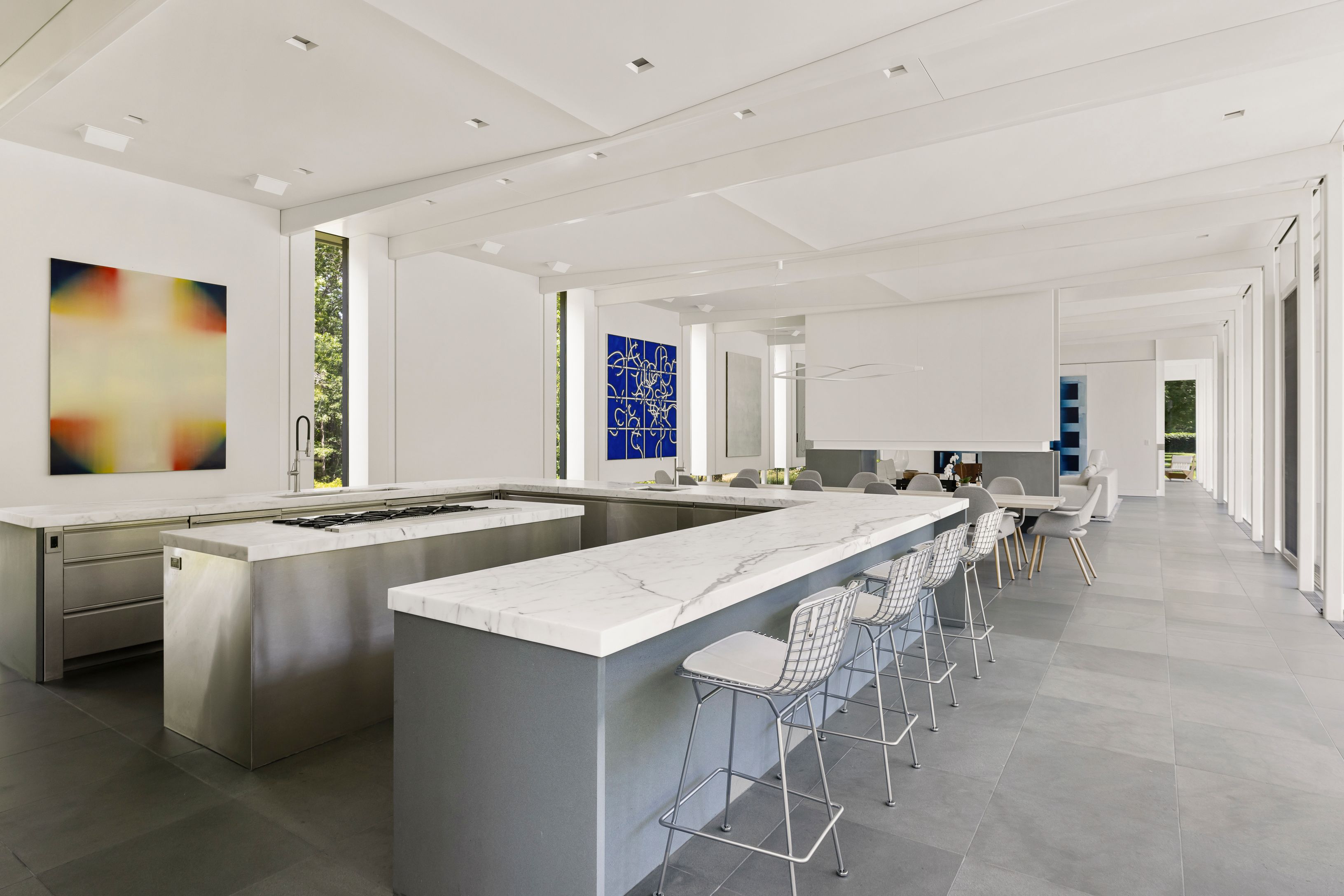 13 Terrys Trail East Hampton, NY 11937 - Photo 25 of 51 a large dining hall with stainless steel appliances granite countertop a sink and a refrigerator