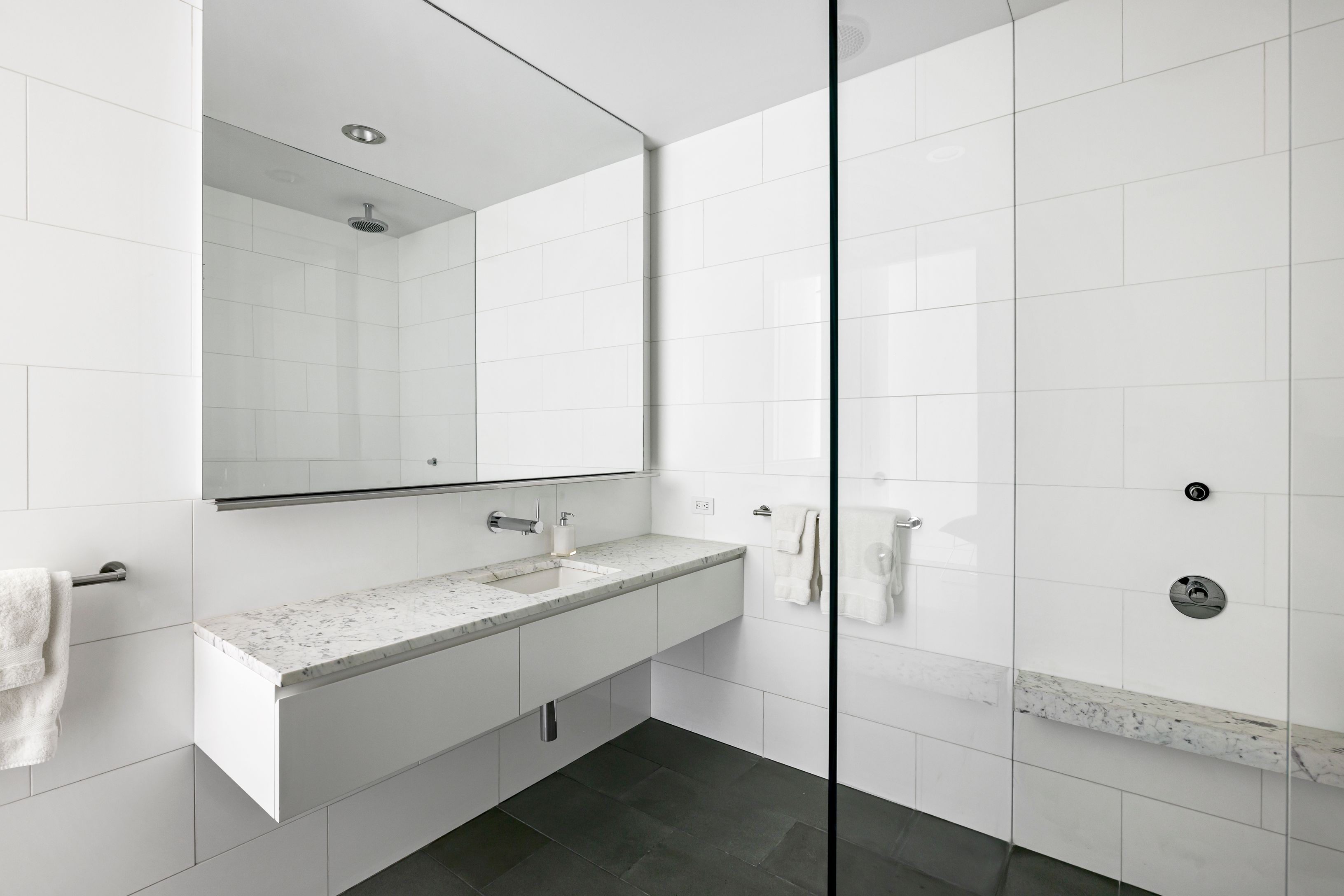 13 Terrys Trail East Hampton, NY 11937 - Photo 39 of 51 a bathroom with a sink and a mirror