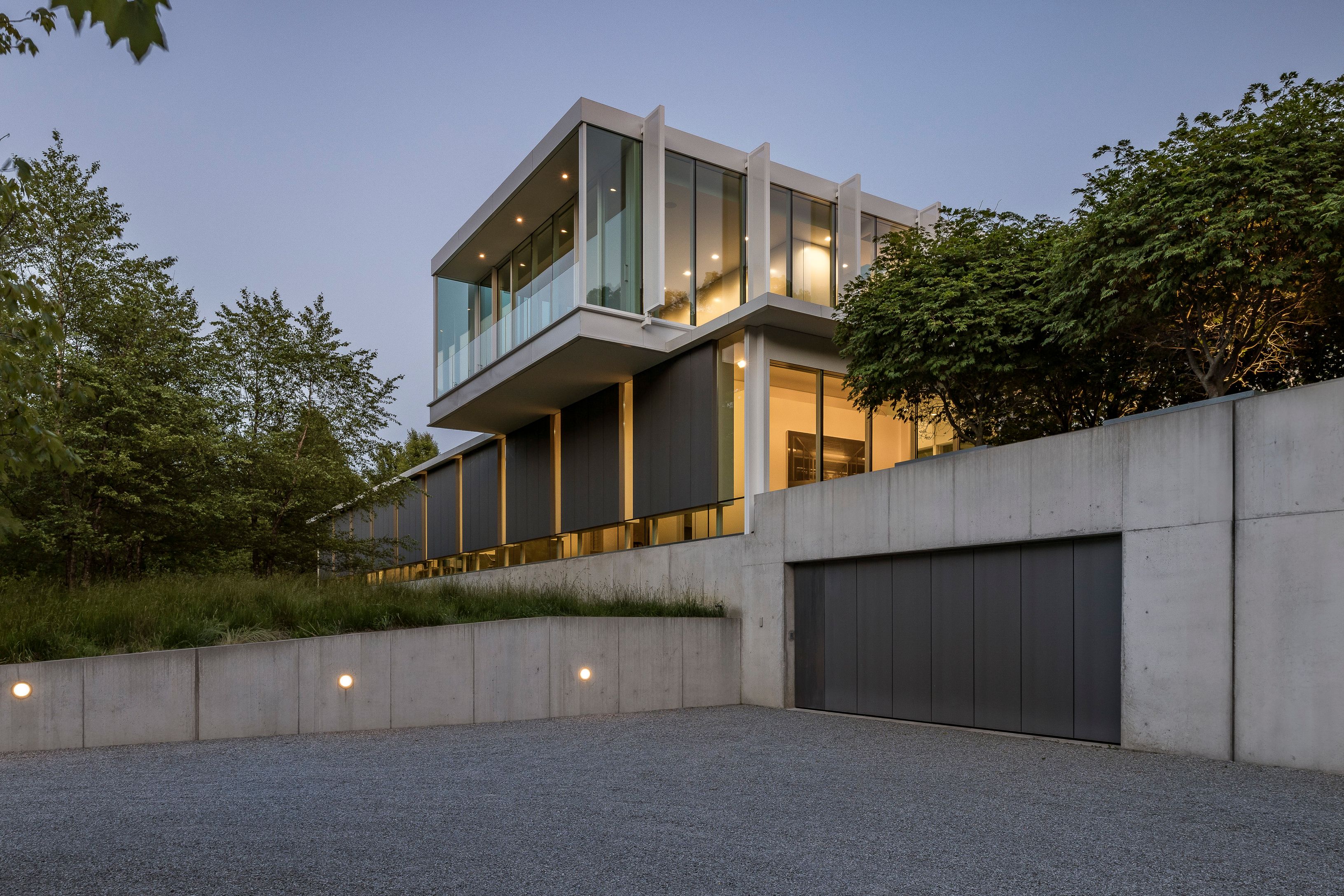 13 Terrys Trail East Hampton, NY 11937 - Photo 5 of 51 a front view of a house with a garage
