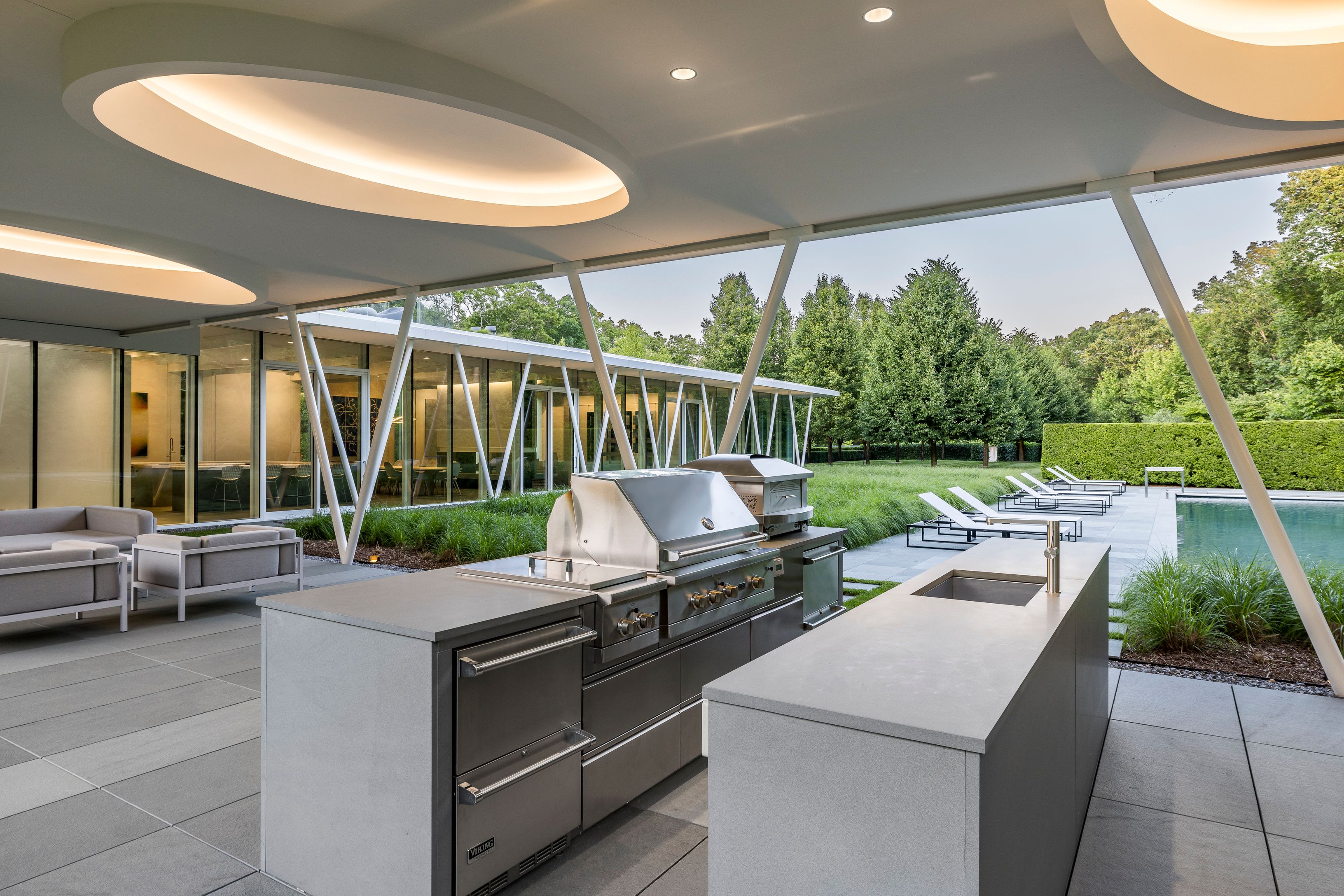 13 Terrys Trail East Hampton, NY 11937 - Photo 10 of 51 a view of a patio with a dining table and chairs
