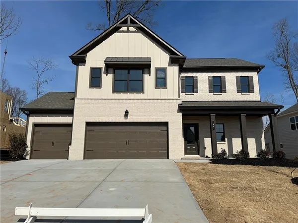 a front view of a house with a garage