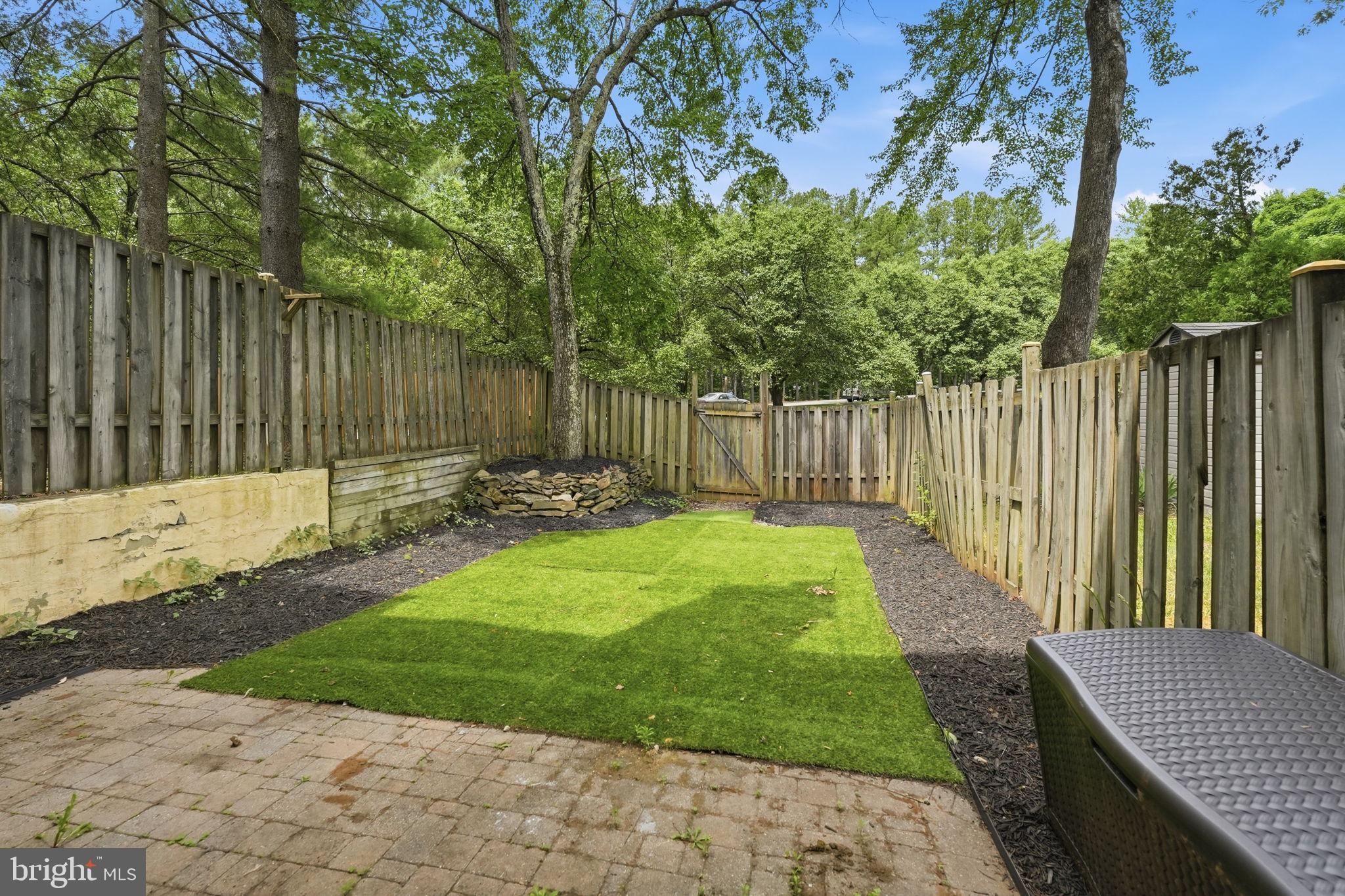 8260 Getty Court Springfield, VA 22153 - Photo 28 of 31 a garden view with tall trees