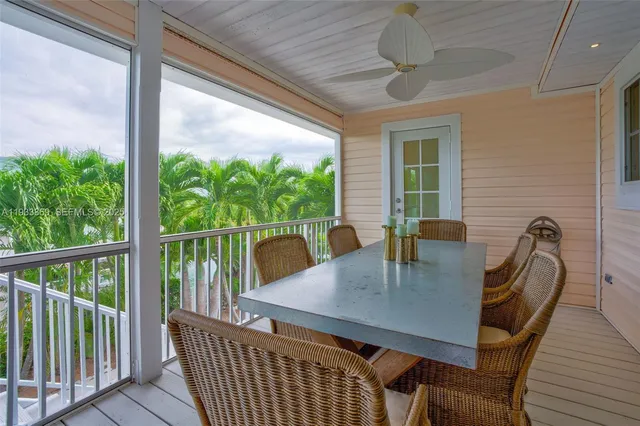a living room with furniture tv and a large window