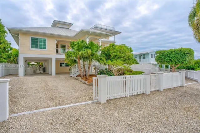 an aerial view of house with yard swimming pool and outdoor seating