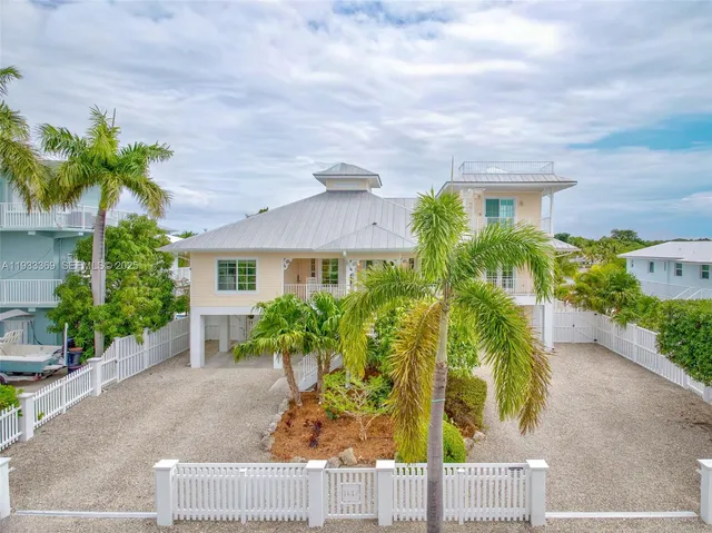 an aerial view of a house with a garden